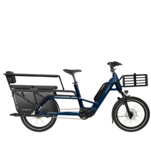 Blue cargo bicycle with a long rear rack, front-loading basket, and seating area for passengers behind the rider